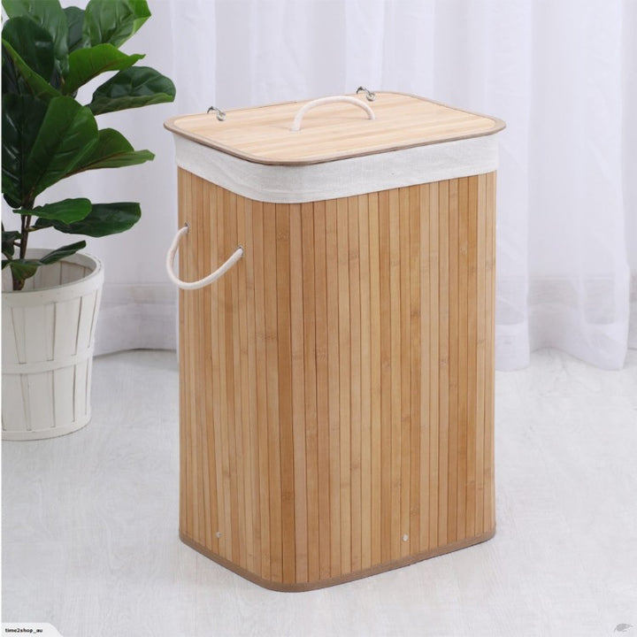 Laundry basket made of natural bamboo with removable cover