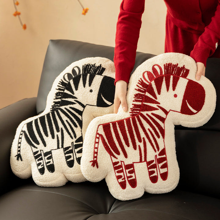 Shaped children's room decorative pillow made of teddy fleece with embroidered zebra motif and contoured silhouette
