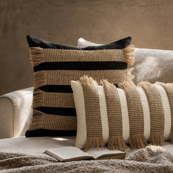 Rectangular boucle decorative pillow with hand-woven jute stripes and long fringes