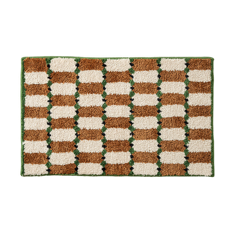 Hand-tufted bathroom mat with a velvety pile, non-slip latex backing, and geometric honeycomb check pattern