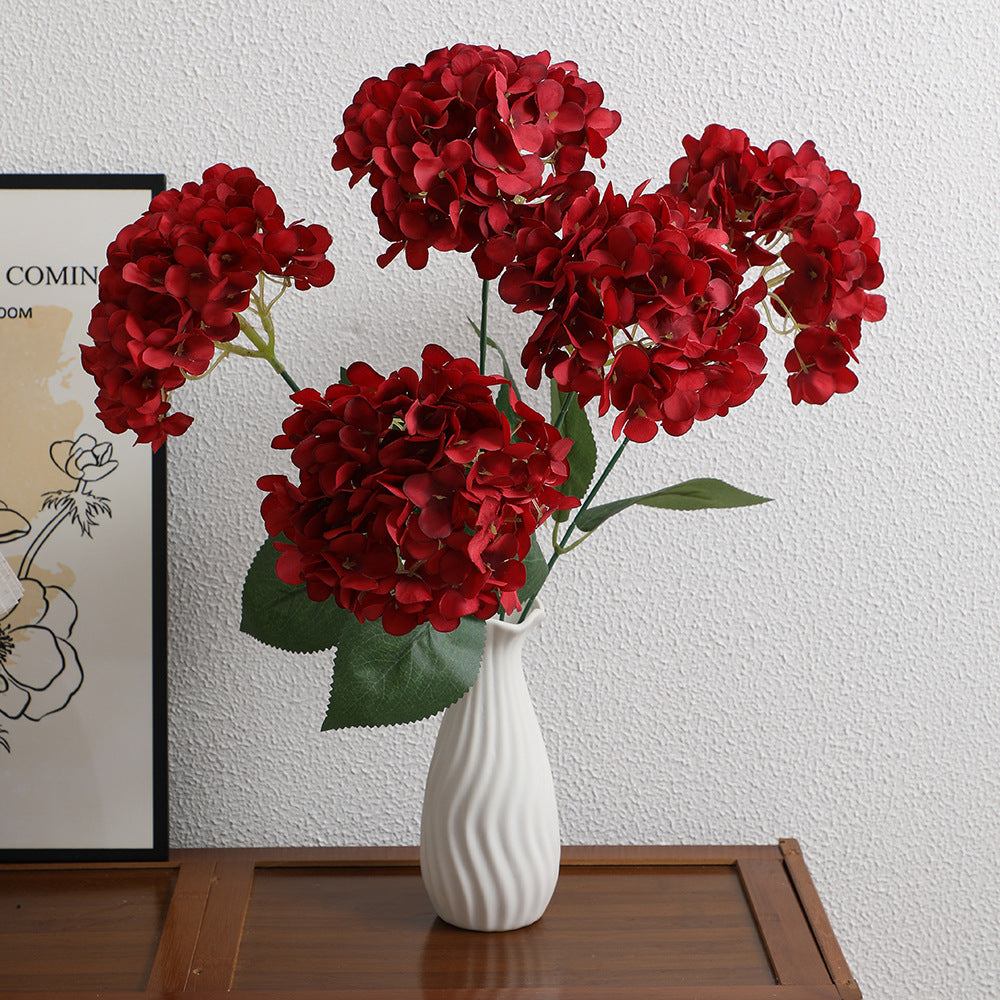 Decorative artificial flower arrangement