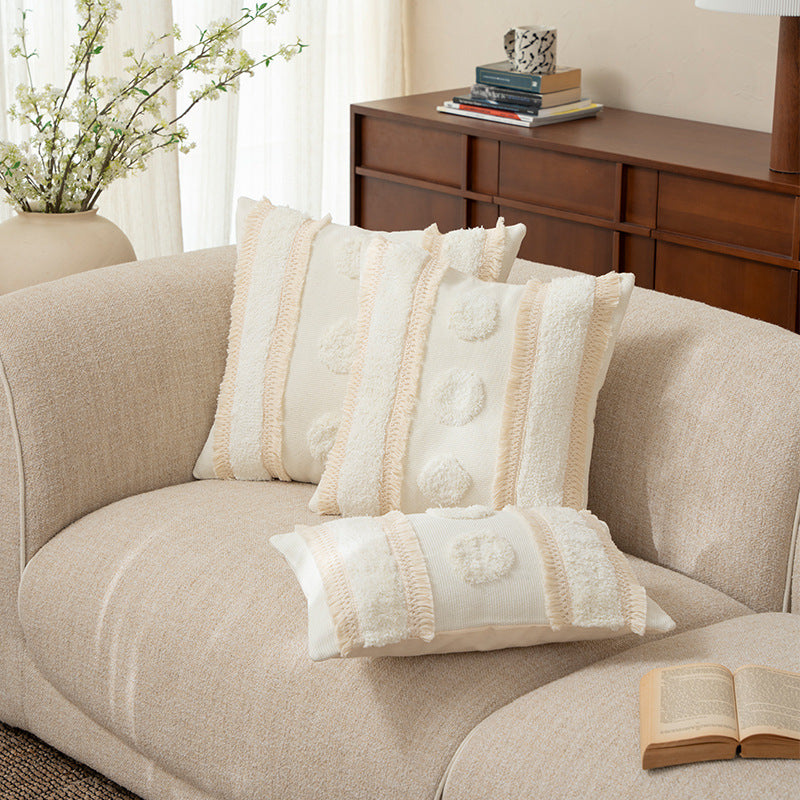 Square cushions with structured boucle look, quilted tufting and decorative tassels