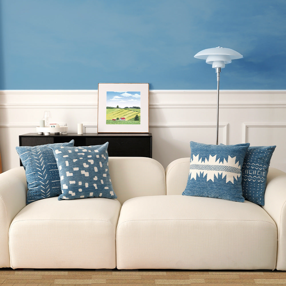 Woven pillow cover with geometric ethnic relief and textured tufting look