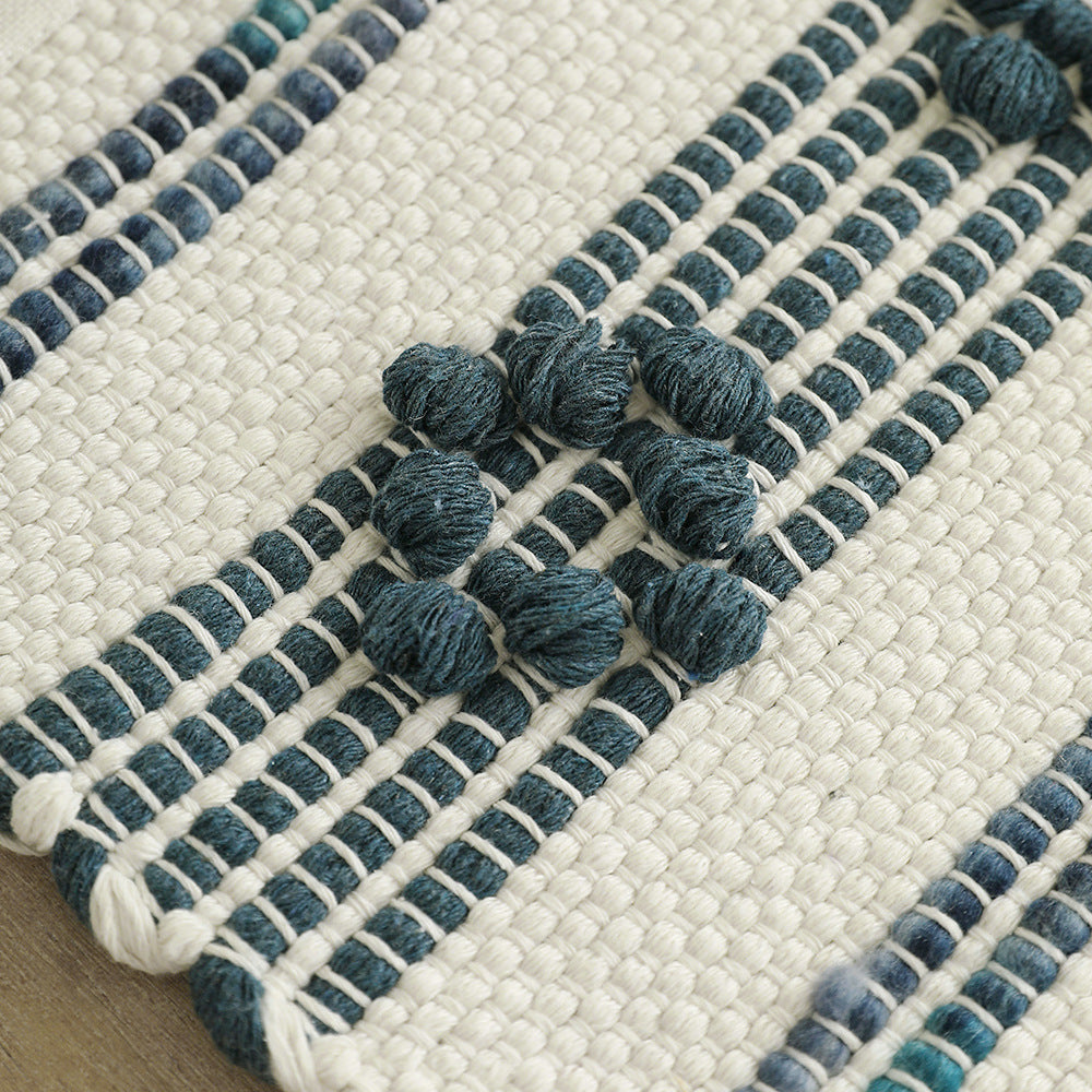 Woven cotton table runner with fringes and textured pattern