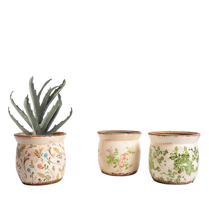 Decorative ceramic plant container with artistic design