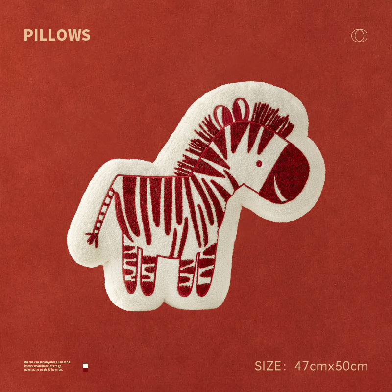 Shaped children's room decorative pillow made of teddy fleece with embroidered zebra motif and contoured silhouette