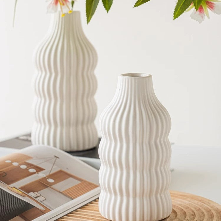 Stylish ceramic vase with wave structure