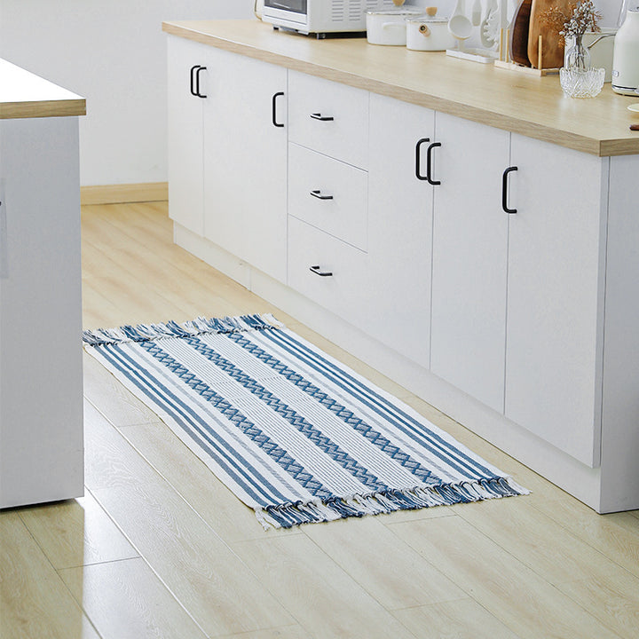 Flat-woven cotton runner with fringes and graphic ethnic stripe pattern