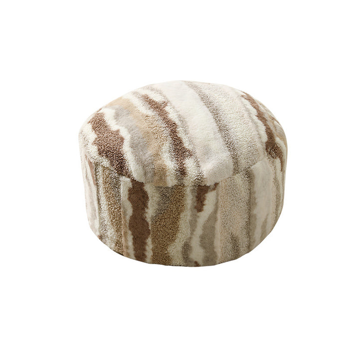Round seating pouf made of teddy fleece with soft textured cover