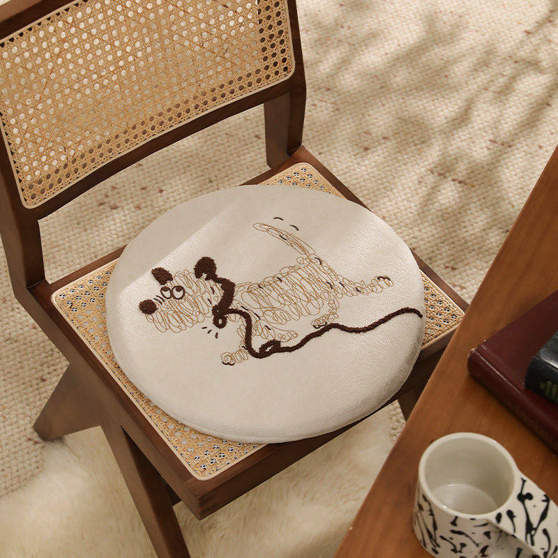 Round padded seat cushion with embroidered cat motif
