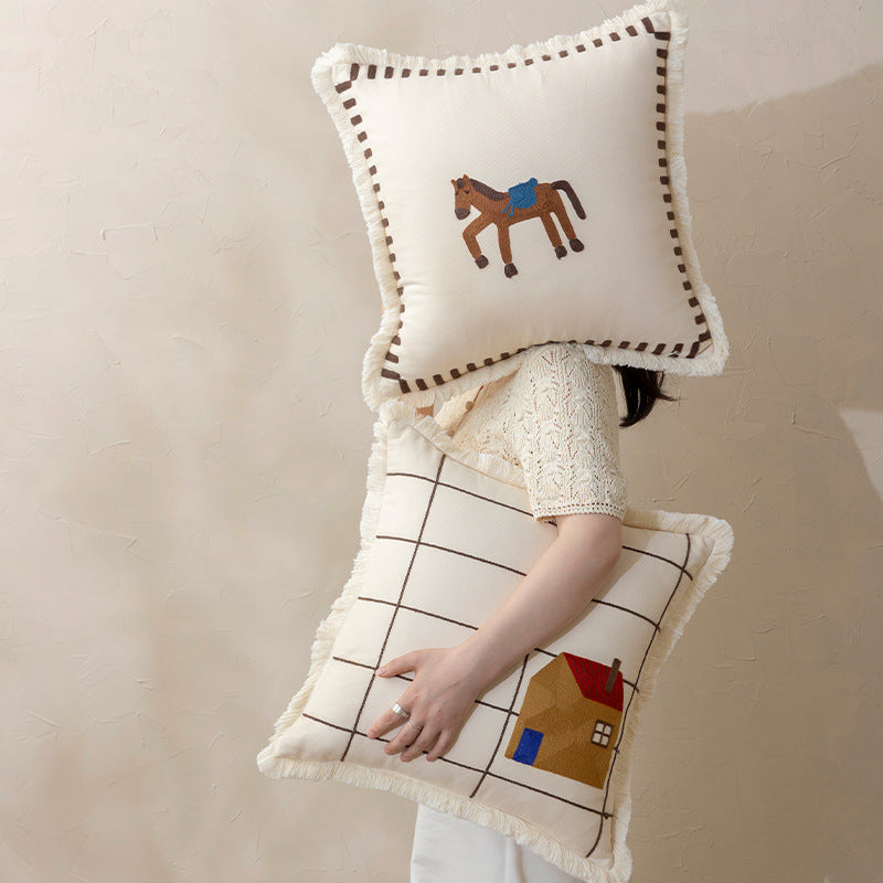 Decorative cushion cover made of cotton blend with fringes, check pattern and embroidered house