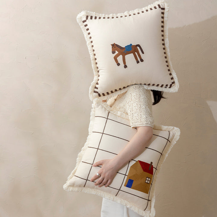 Decorative cushion cover made of cotton blend with fringes, check pattern and embroidered house