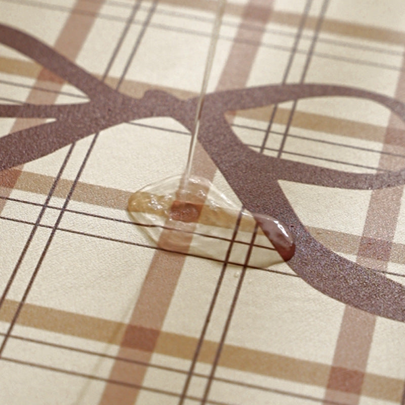 Rectangular table set placemat made of coated cotton mix with check pattern, decorative edge and bow motif