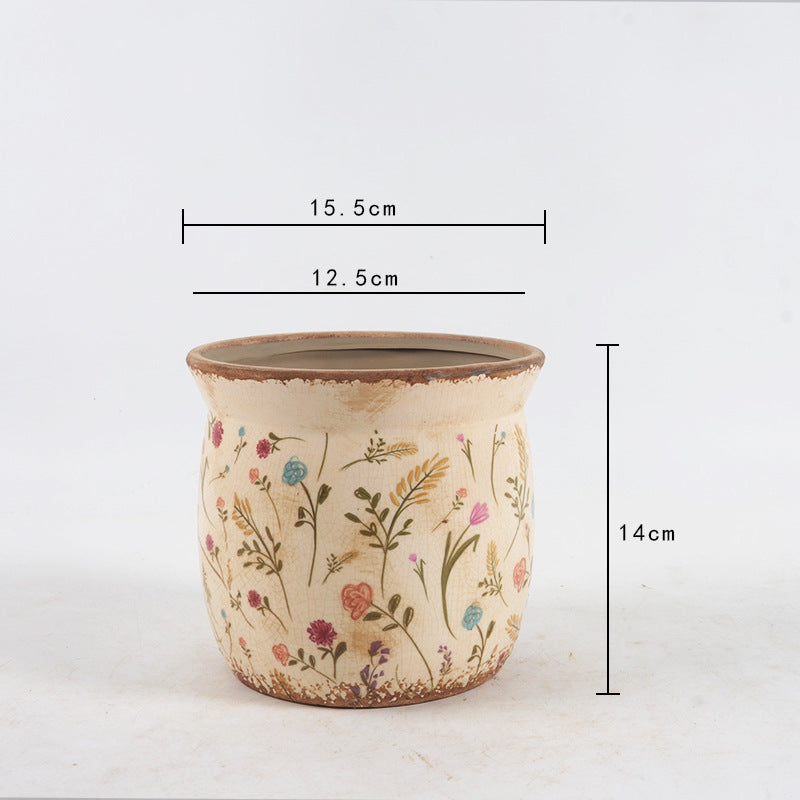 Decorative ceramic plant container with artistic design