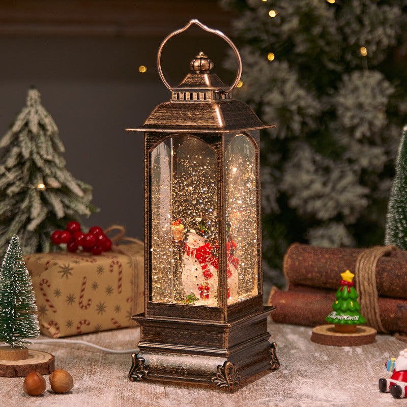 Illuminated Christmas lantern with snow and Christmas motif