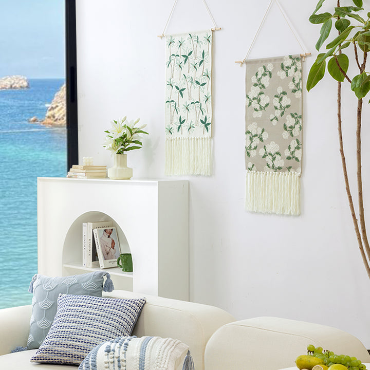 Woven wall hanging with floral jacquard structure and long fringes