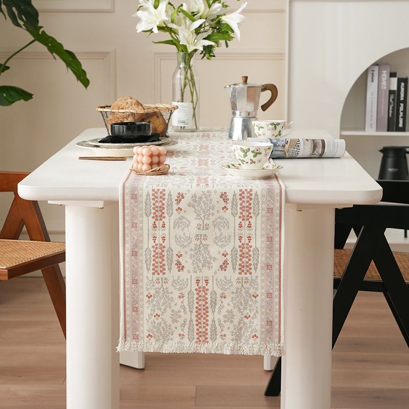 Woven jacquard table runner with floral medallion and fringes
