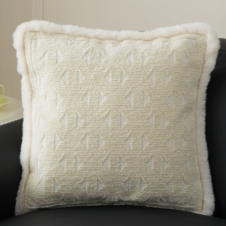 Square decorative pillow with embossed circular relief and soft faux fur edging