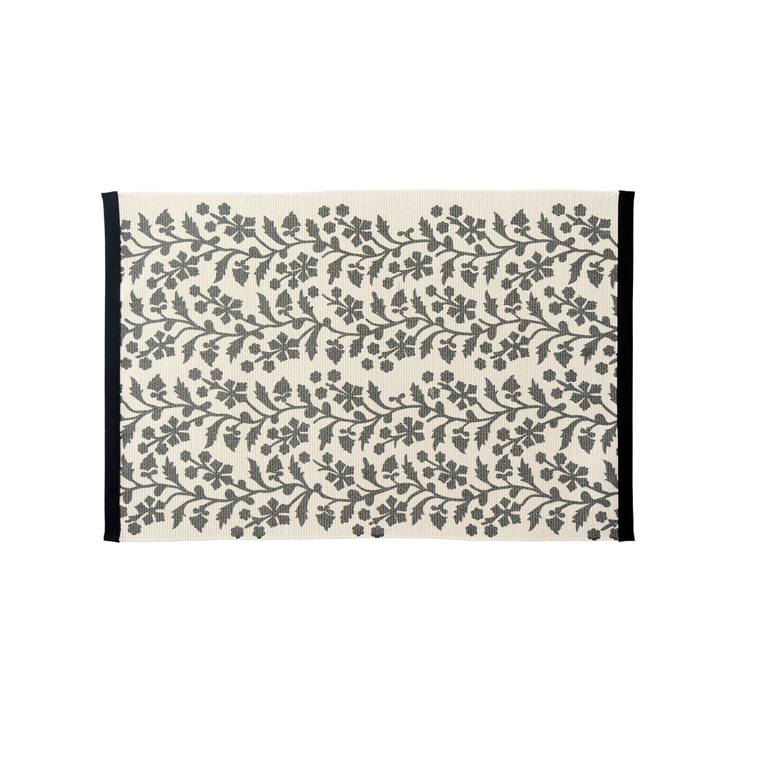 Woven table runner with floral vinyl print look and reinforced overlock stitching