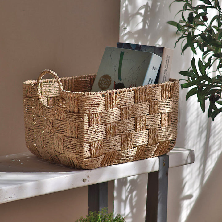 Handmade storage basket with practical handle