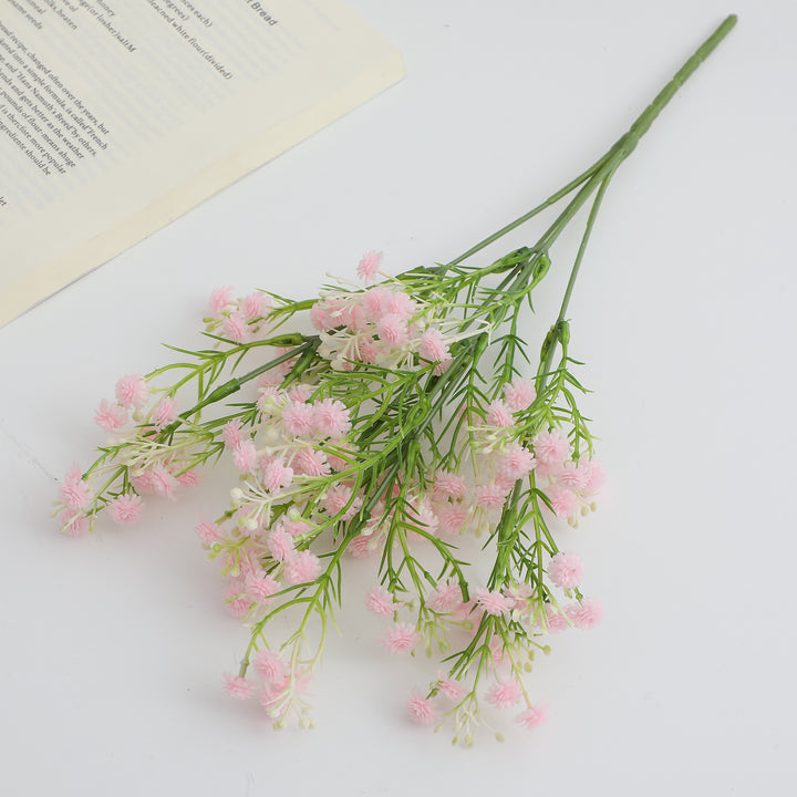 Decorative artificial flower branch with delicate purple flowers