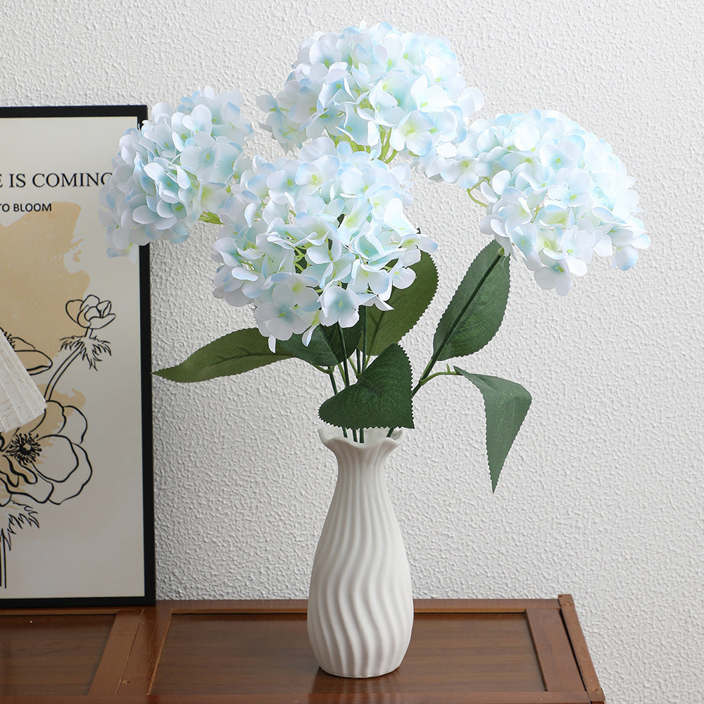 Decorative artificial flower arrangement