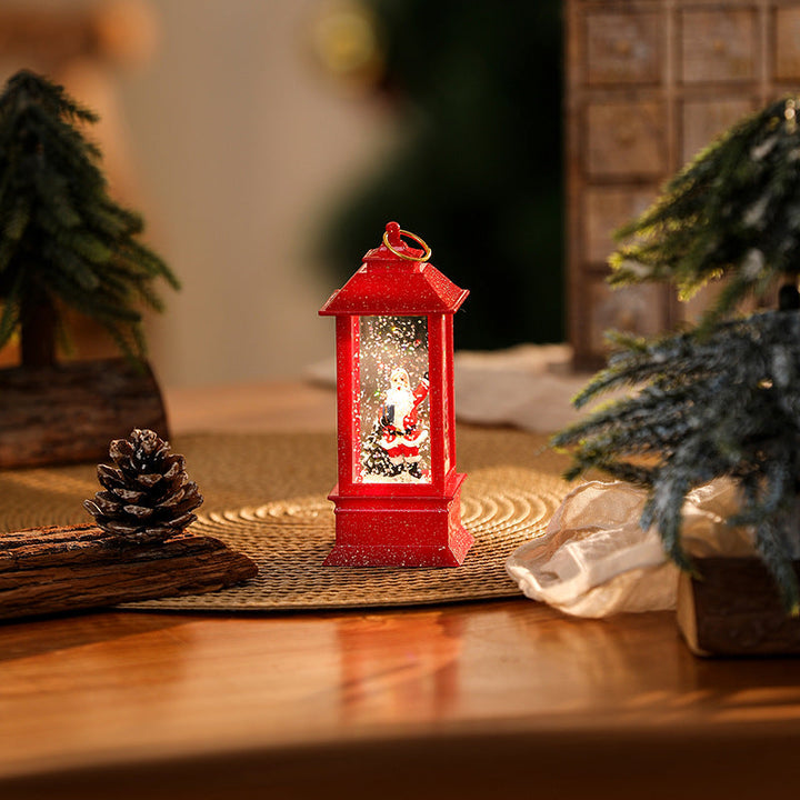 Illuminated Christmas lantern with glittering snowman scene