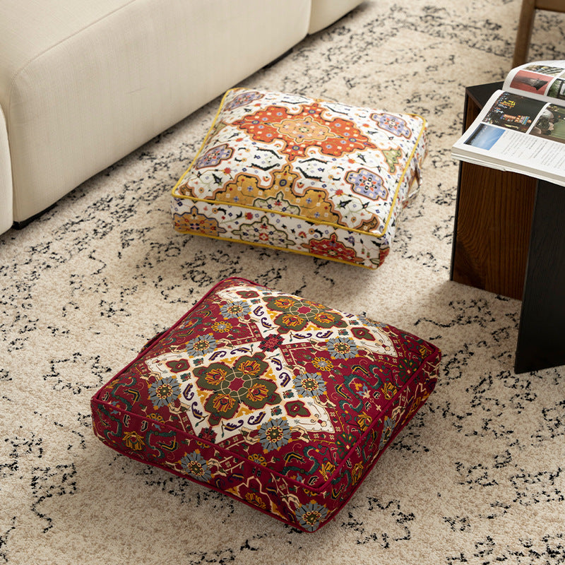 Square decorative cushion with oriental medallion print, piping and carrying handle