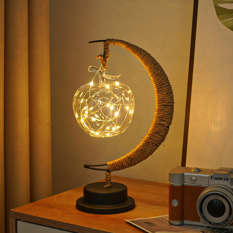 Decorative glass apple LED table lamp with moon-shaped rope-wrapped stand