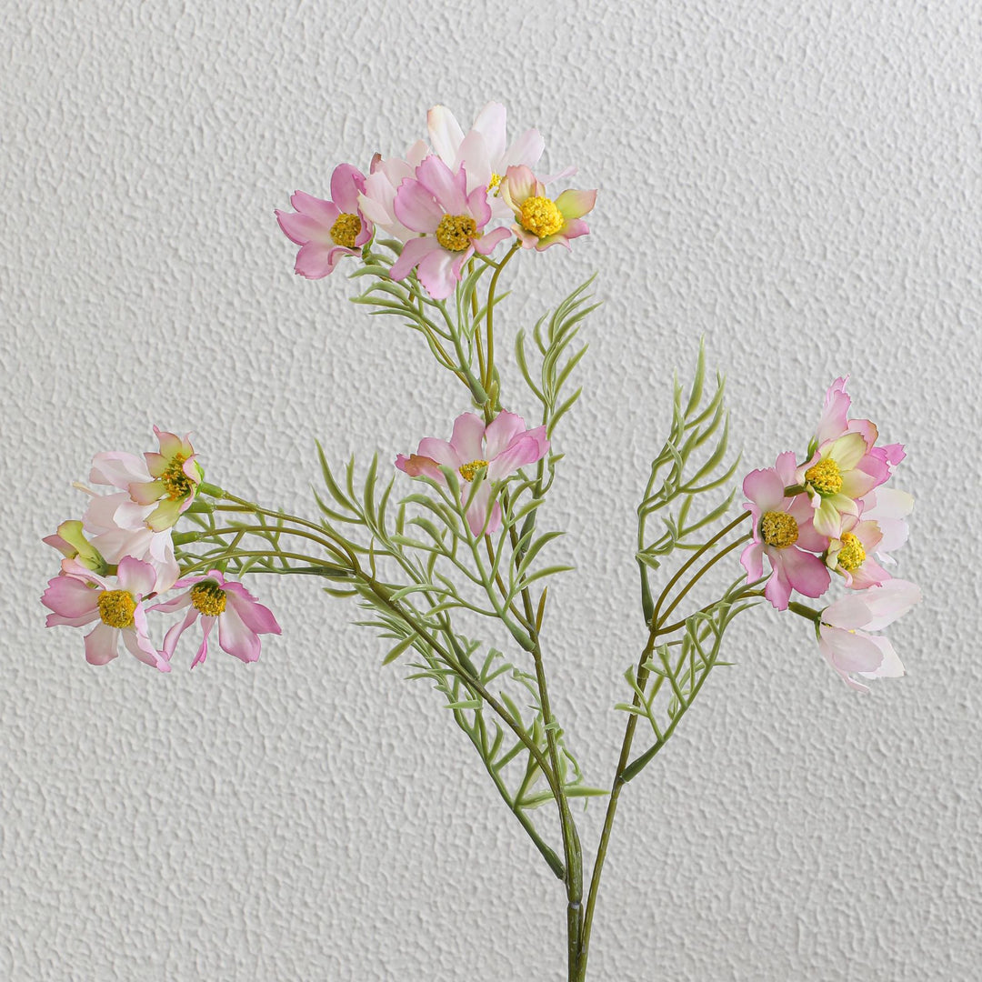 Artificial flower branch with bright pink flowers