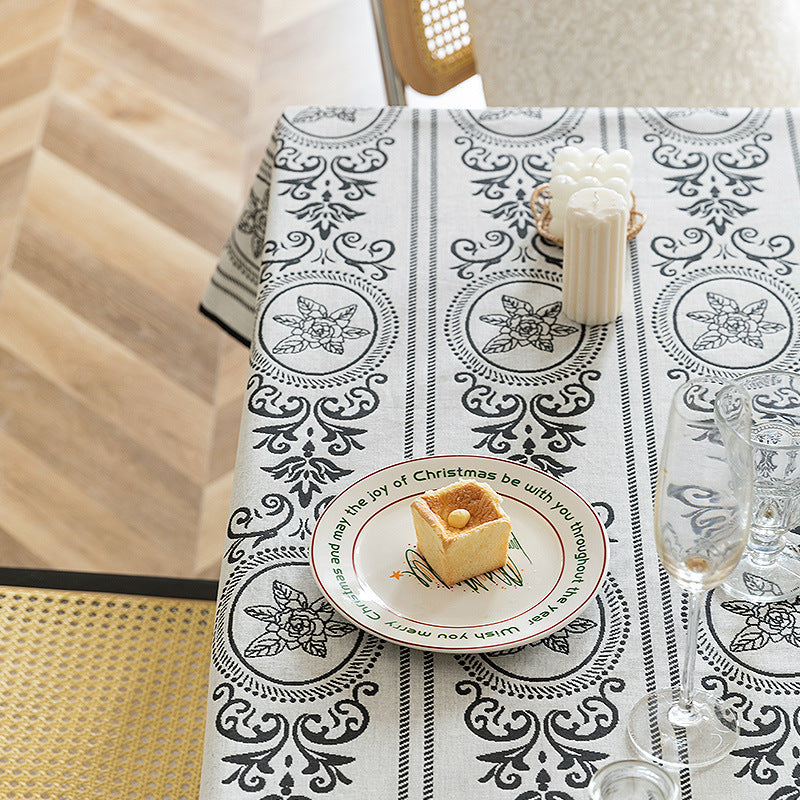 Reversible jacquard tablecloth with floral medallion reliefs