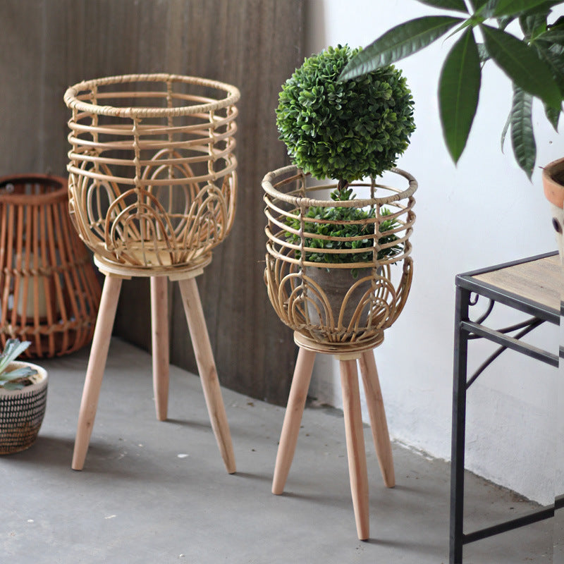 Stylish plant stand made of rattan and wood