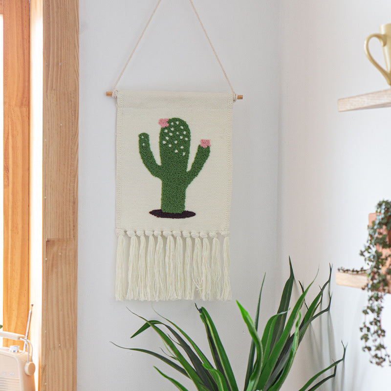 Woven cotton blend wall hanging with tufted cactus motif and cotton fringes