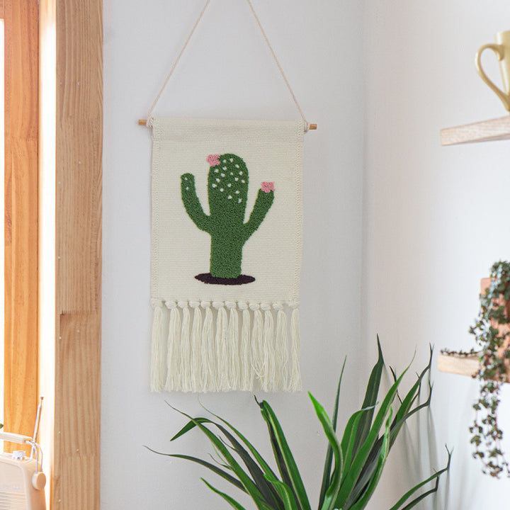 Woven cotton blend wall hanging with tufted cactus motif and cotton fringes