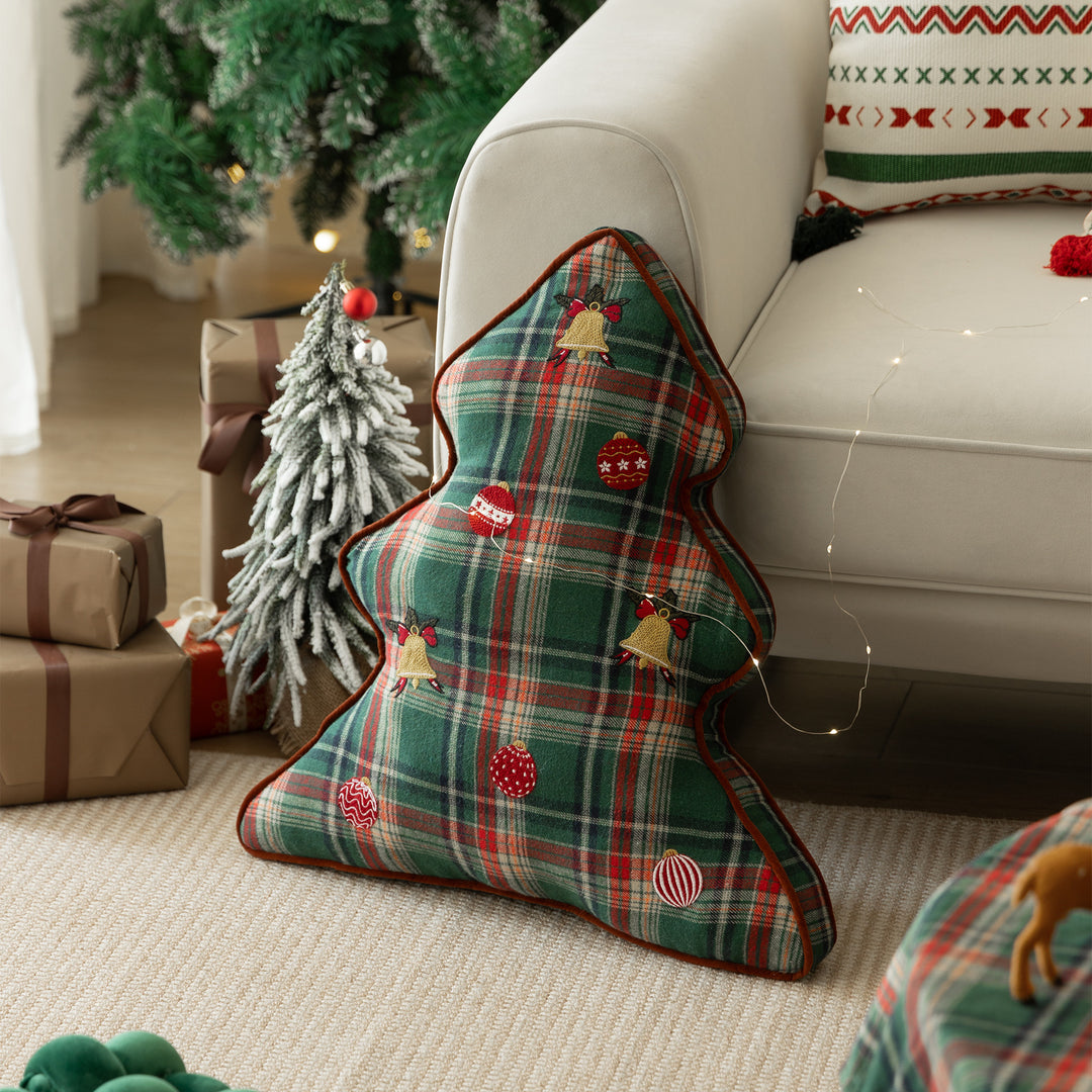 Christmas tree-shaped decorative pillow made of checked flannel with embroidered appliqués