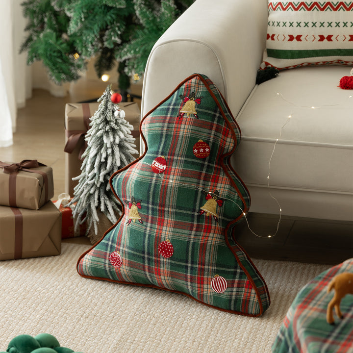 Christmas tree-shaped decorative pillow made of checked flannel with embroidered appliqués