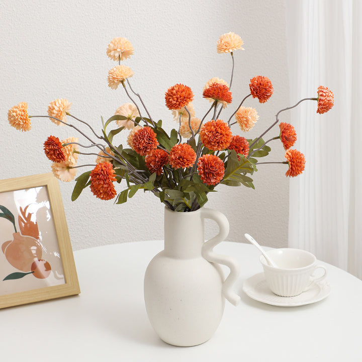 Artificial flower branch with intricate flowers