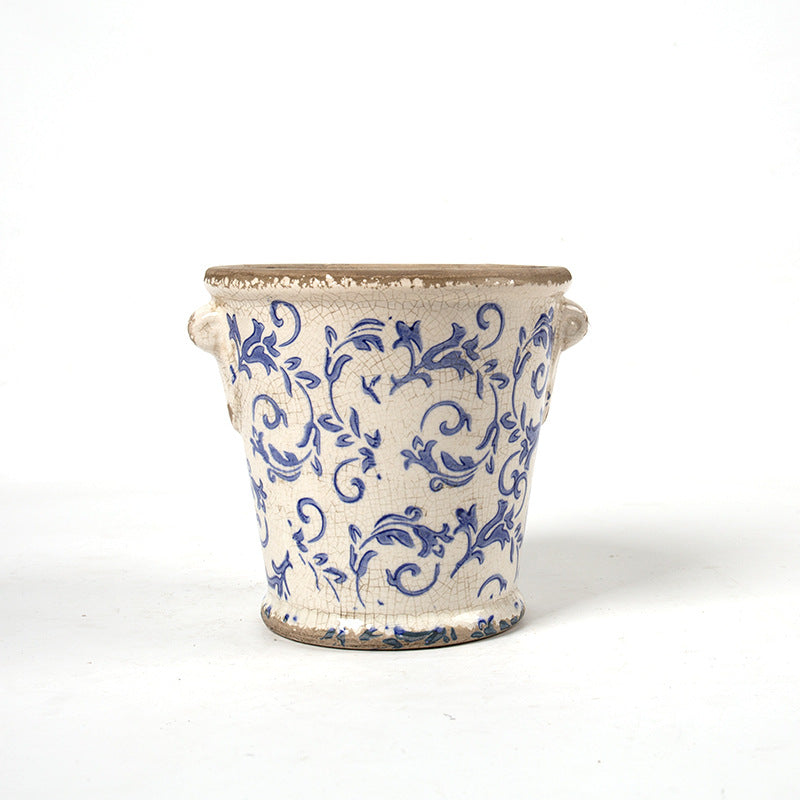 Decorative flower pot with floral embellishments