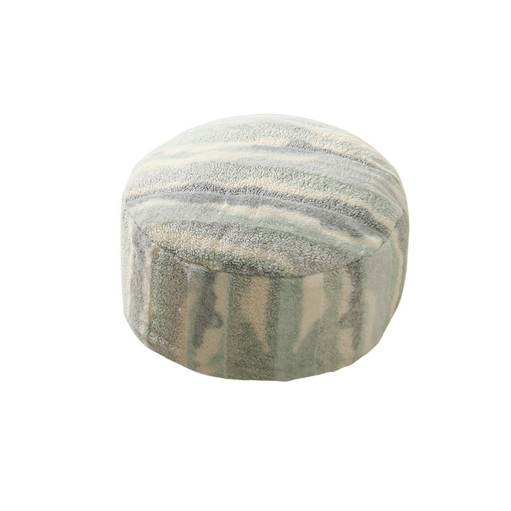 Round seating pouf made of teddy fleece with soft textured cover