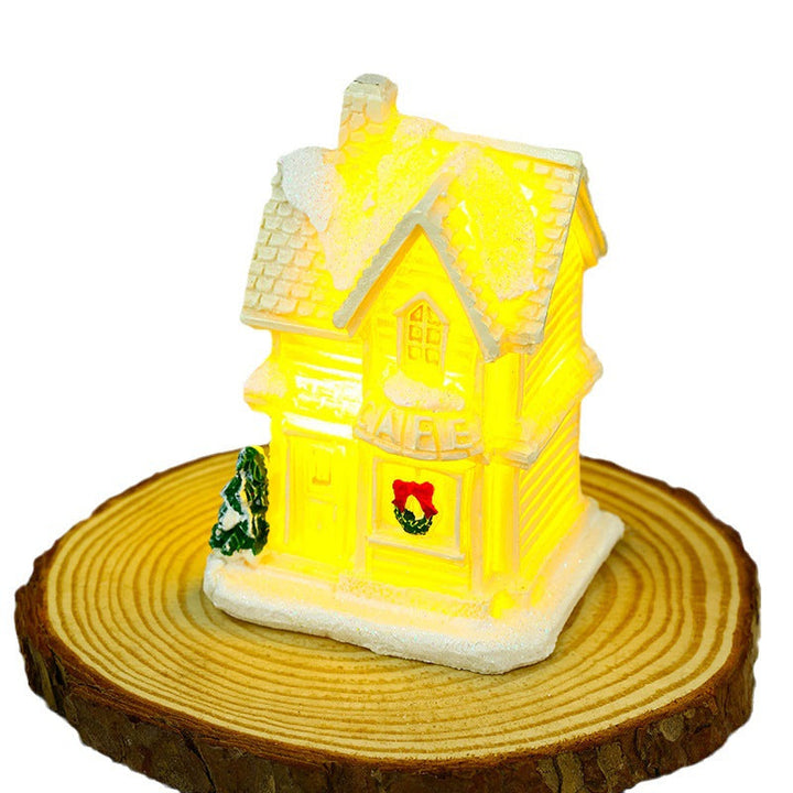 Illuminated Christmas village house with festive decoration