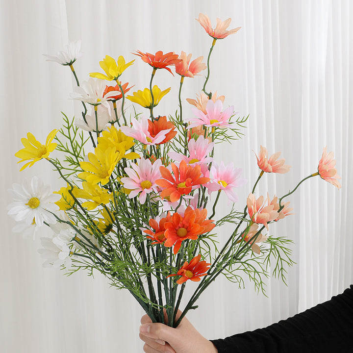 Artificial flower branch with bright blooms and delicate leaves