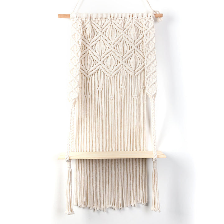 Macramé wall shelf with integrated plant holder