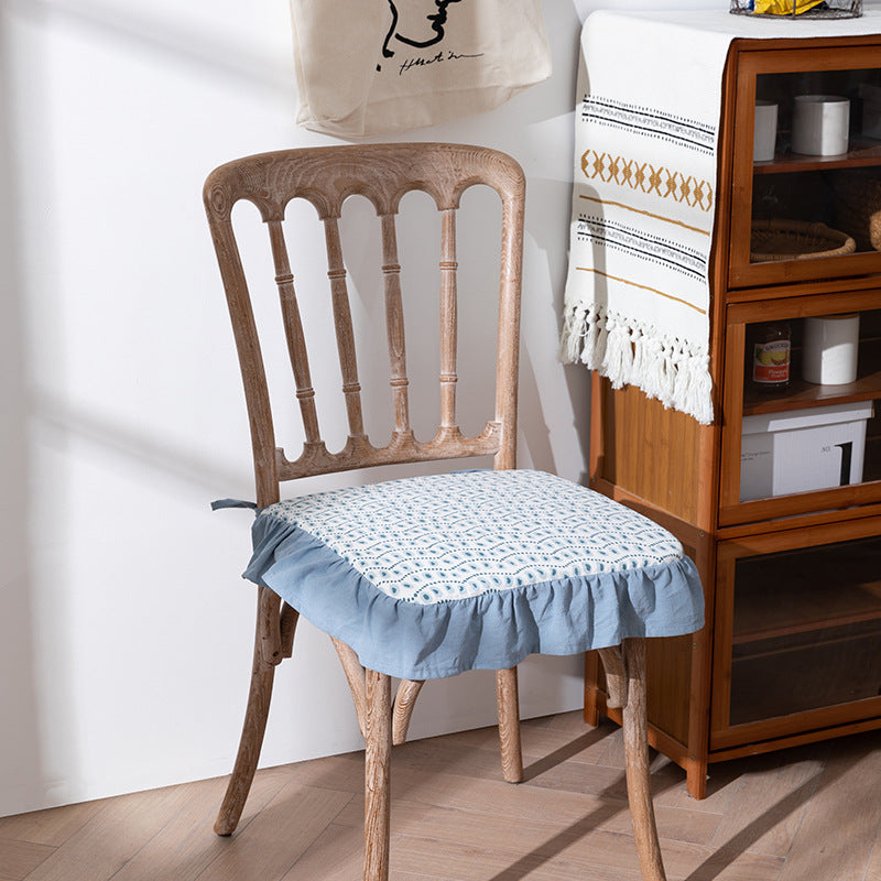 Padded chair seat cushion with tie straps and ruffled edge
