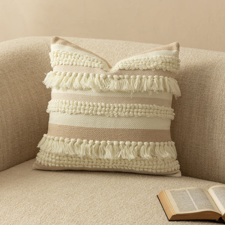 Decorative woven cushion cover with fringes and textured striped design