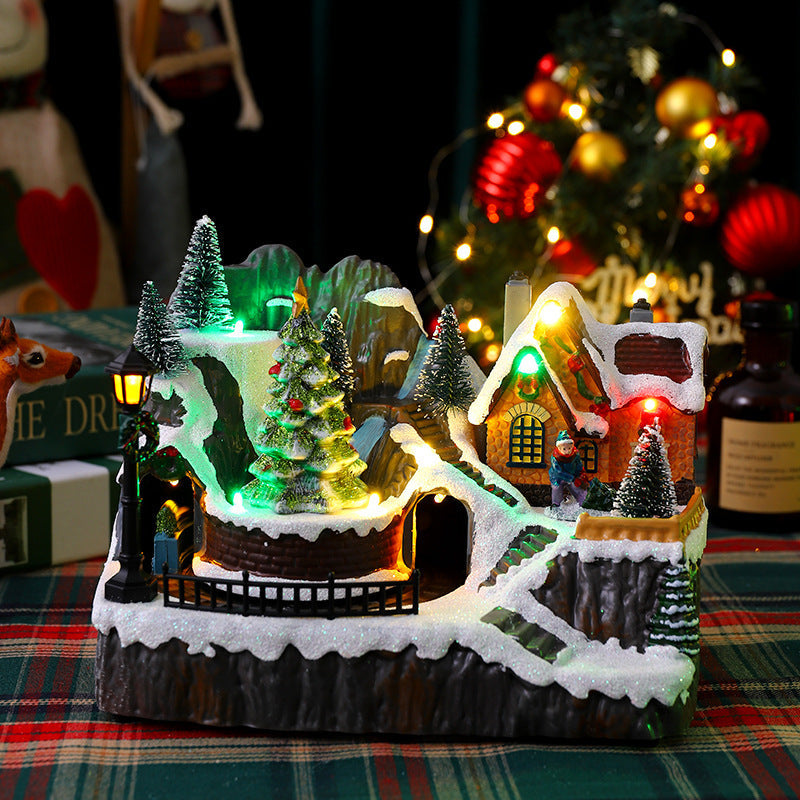 Illuminated Christmas village decoration with moving figures