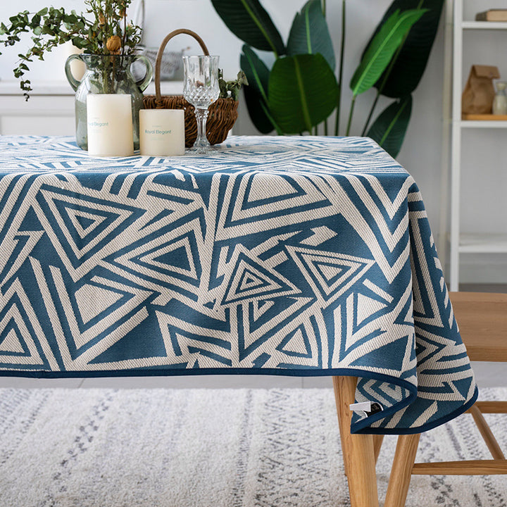 Woven jacquard tablecloth with geometric triangle pattern and easy-care cotton blend
