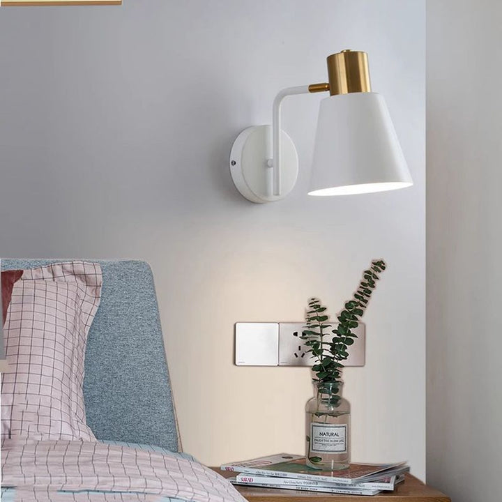 Rotatable cone wall light with brass socket and round back plate