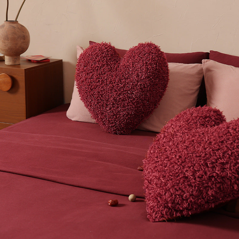 Heart-shaped plush cuddle pillow