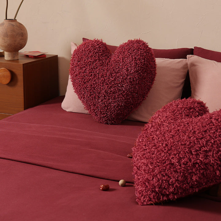 Heart-shaped plush cuddle pillow