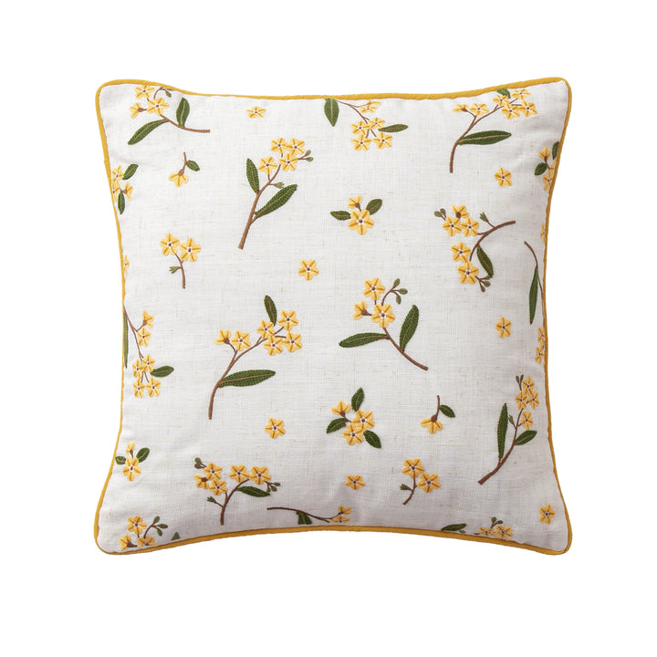 Decorative embroidered cushion cover made of linen blend with floral yellow flower appliqué and piping